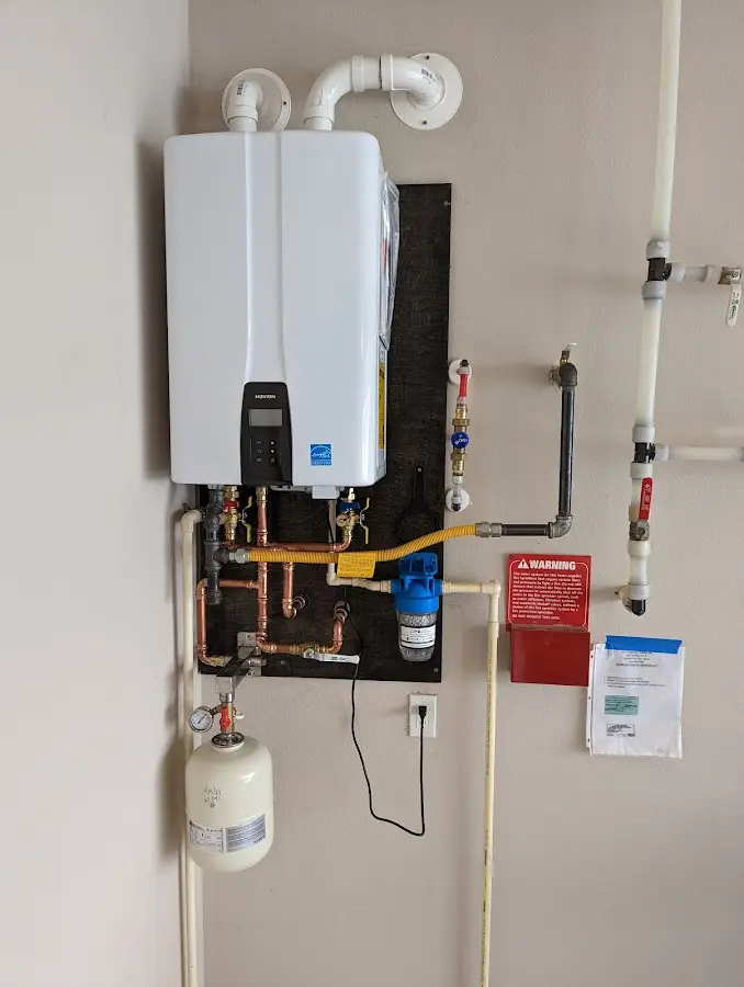 Professional plumber installing copper piping in a Upper Nazareth home